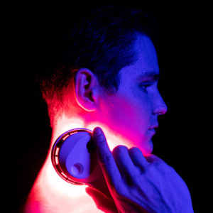 Man using a SunPowerLED Palm on his neck