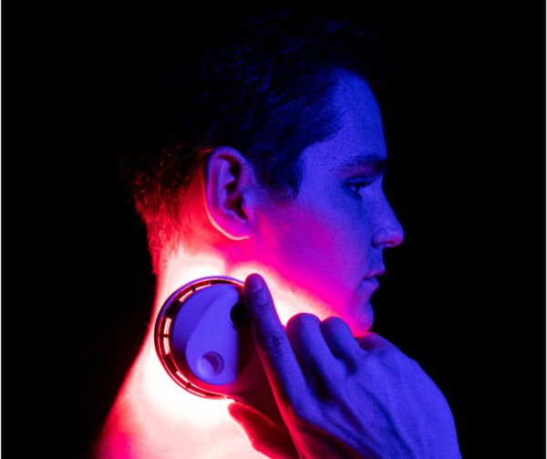 Man using a SunPowerLED Palm on his neck